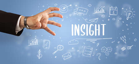 Close-Up of cropped hand pointing at INSIGHT inscription, modern business solution conceptの写真素材
