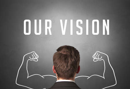 Rear view of a businessman with OUR VISION inscription, powerfull business conceptの写真素材