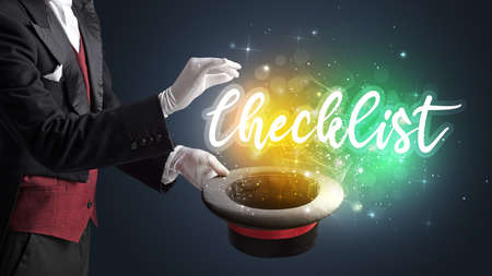 Magician hand conjure with wand and Checklist inscription, shopping conceptの写真素材