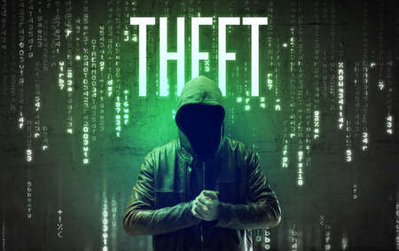 Faceless hacker with THEFT inscription, hacking conceptの写真素材