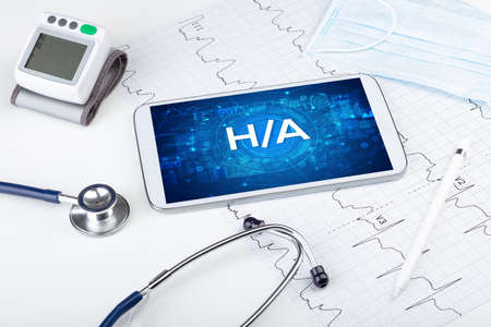 Close-up view of a tablet pc with H/A abbreviation, medical concept