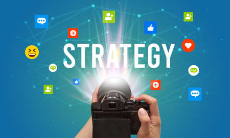 Using camera to capture social media content with STRATEGY inscription, social media content conceptの写真素材
