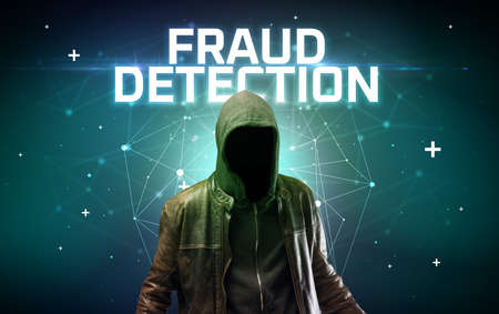 Mysterious hacker with FRAUD DETECTION inscription, online attack concept inscription, online security conceptの写真素材