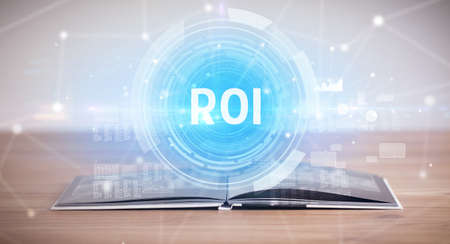 Open book with ROI abbreviation, modern technology conceptの写真素材