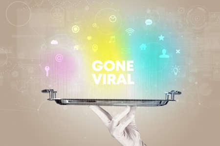 Waiter serving social networking with GONE VIRAL inscription, new media conceptの写真素材
