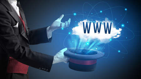 Magician is showing magic trick with WWW abbreviation, modern tech concept