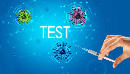 Syringe, medical injection in hand with TEST inscription, coronavirus vaccine conceptの写真素材