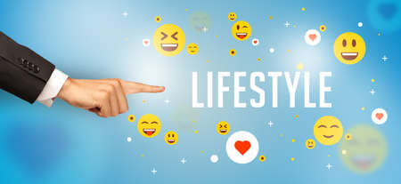 Close-Up of cropped hand pointing at LIFESTYLE inscription, social media conceptの写真素材