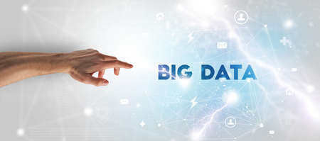 Hand pointing at BIG DATA inscription, modern technology concept