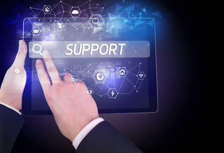 Close-up of a tablet searching SUPPORT inscription, hi-tech computing concept