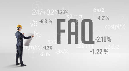 Technology Engineer in hard hat with FAQ abbreviationの写真素材