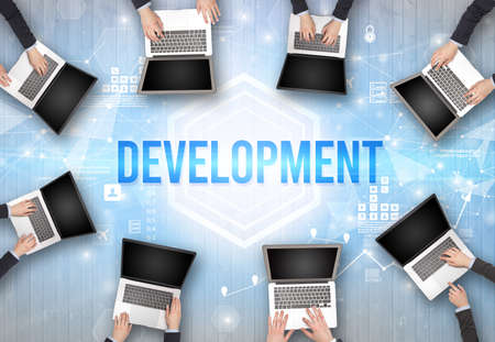 Group of Busy People Working in an Office with DEVELOPMENT inscription, modern technology conceptの写真素材