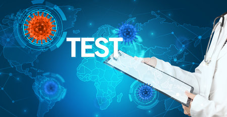 Doctor fills out medical record with TEST inscription, virology conceptの写真素材