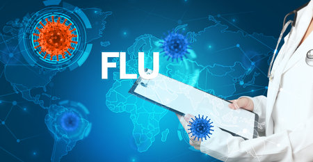 Doctor fills out medical record with FLU inscription, virology conceptの写真素材