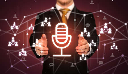 Hand holdig microphone icon around his hands, Social networking concept