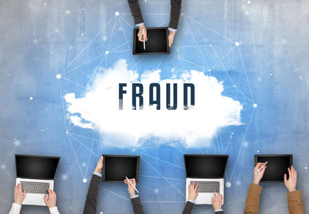 Group of people having a meeting with FRAUD insciption, web security conceptの写真素材