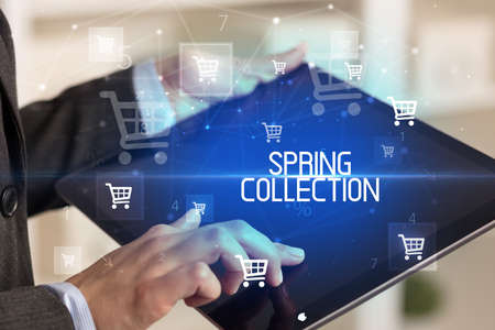 Young person makes a purchase through a tabletの写真素材