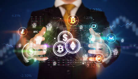 Businessman holding currency symbols