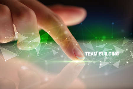 Finger touching tablet with business connection conceptの写真素材