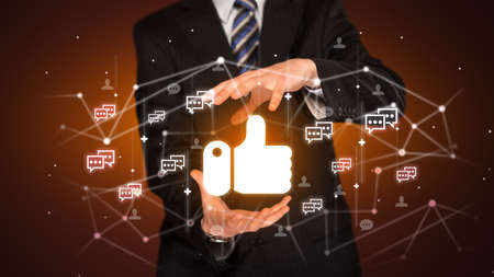 Hand holding social media icons