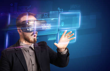 Businessman looking through Virtual Reality glasses, tech conceptの写真素材