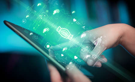 Close-up of a touchscreen with healthcare icons