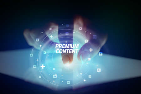 Finger touching tablet with social media icons concept. PREMIUM CONTENT