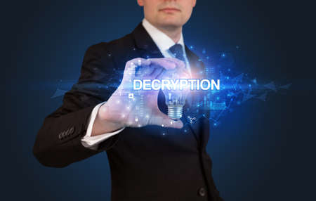 Businessman holding a light bulbの写真素材