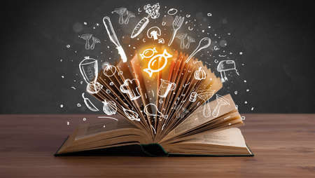 Open recipe book with food related icons above