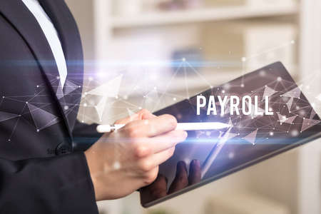 Close up hands using tabletの写真素材