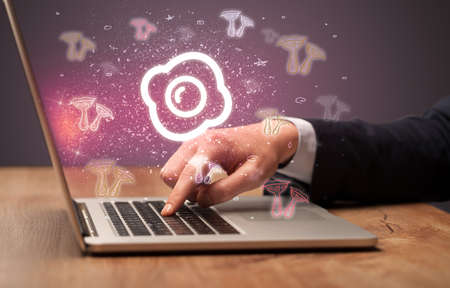 Hand searching for recipes on the internet