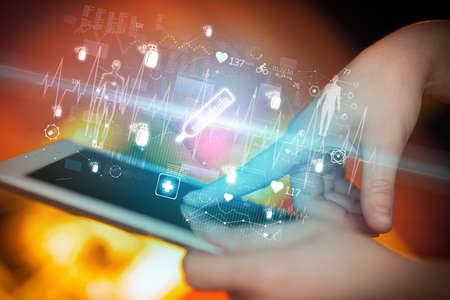 Close-up of a touchscreen with thermometer icons, modern healthcare conceptの写真素材