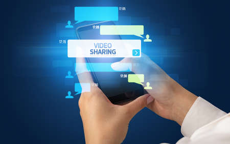 Hand using smartphone with social media conceptの写真素材