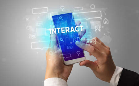 Hand using smartphone with social media conceptの写真素材