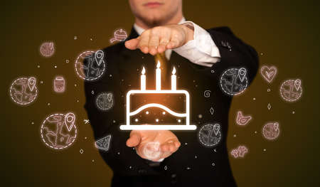 Hand holding food related iconsの写真素材