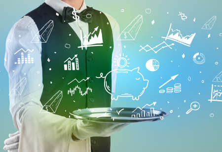 Handsome young waiter in tuxedo holding money icons on trayの写真素材