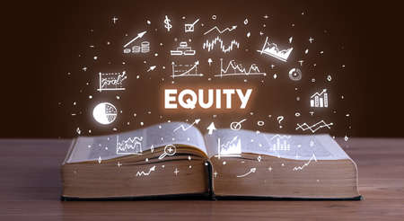 Business inscription coming out from an open bookの写真素材