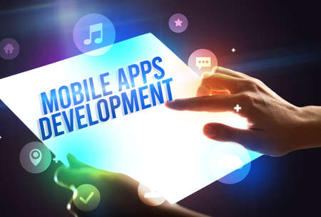 Holding futuristic tablet, new media conceptの写真素材