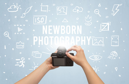 Hand taking picture with digital cameraの写真素材
