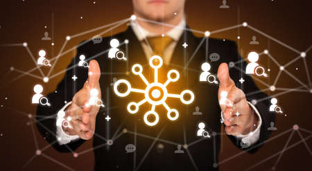 Hand holding social media icons