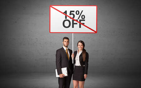 business person holding a traffic sign conceptの写真素材