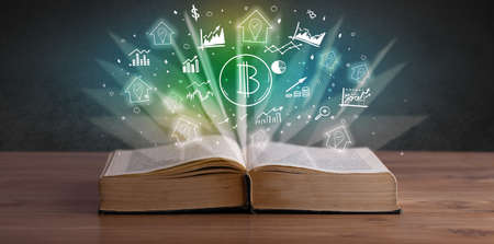 Open book with profit icons aboveの写真素材