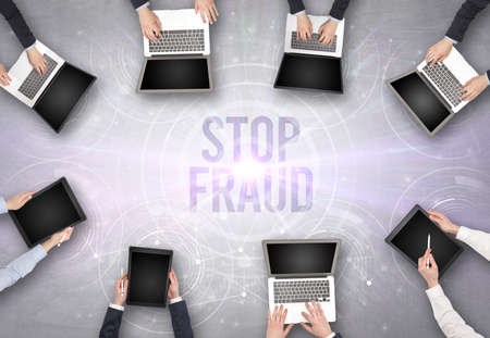 Group of people in front of a laptop, security conceptの写真素材