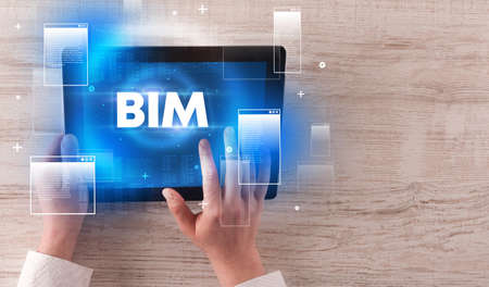 Close-up of a hand holding tabletの写真素材