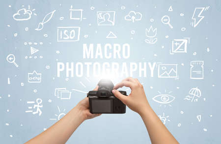 Hand taking picture with digital cameraの写真素材
