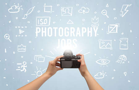 Hand taking picture with digital cameraの写真素材