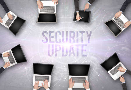 Group of people in front of a laptop, security concept