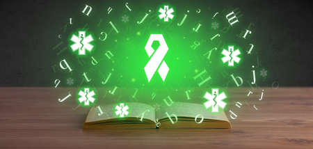 Open medical book with health icons above
