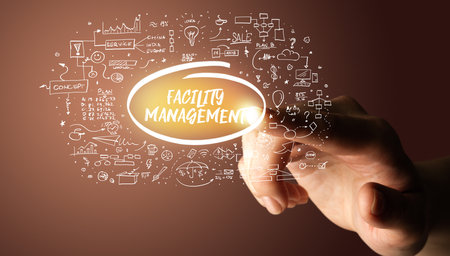 Hand touching hand drawn icons conceptの写真素材