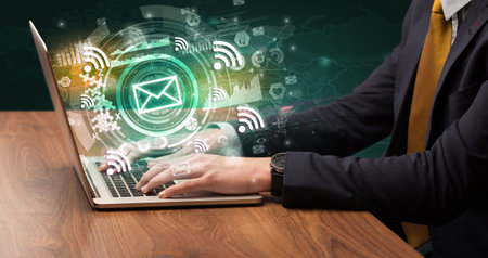 Business hand typing on a modern laptopの写真素材